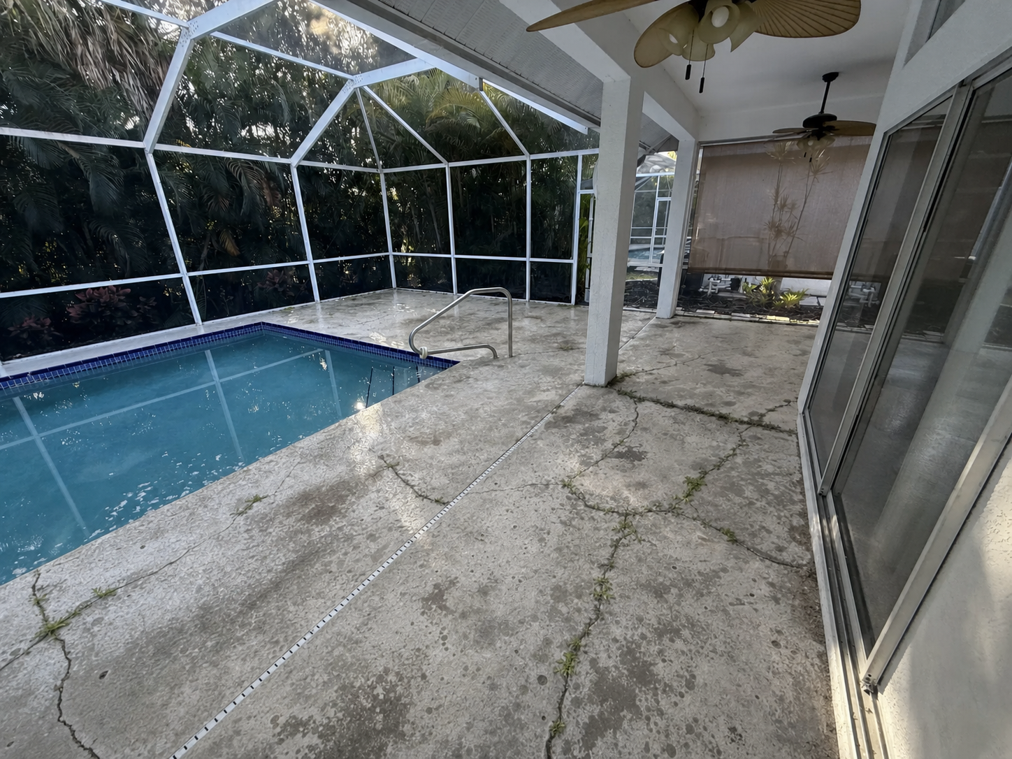 Patio before epoxy coating - cracked weathered concrete